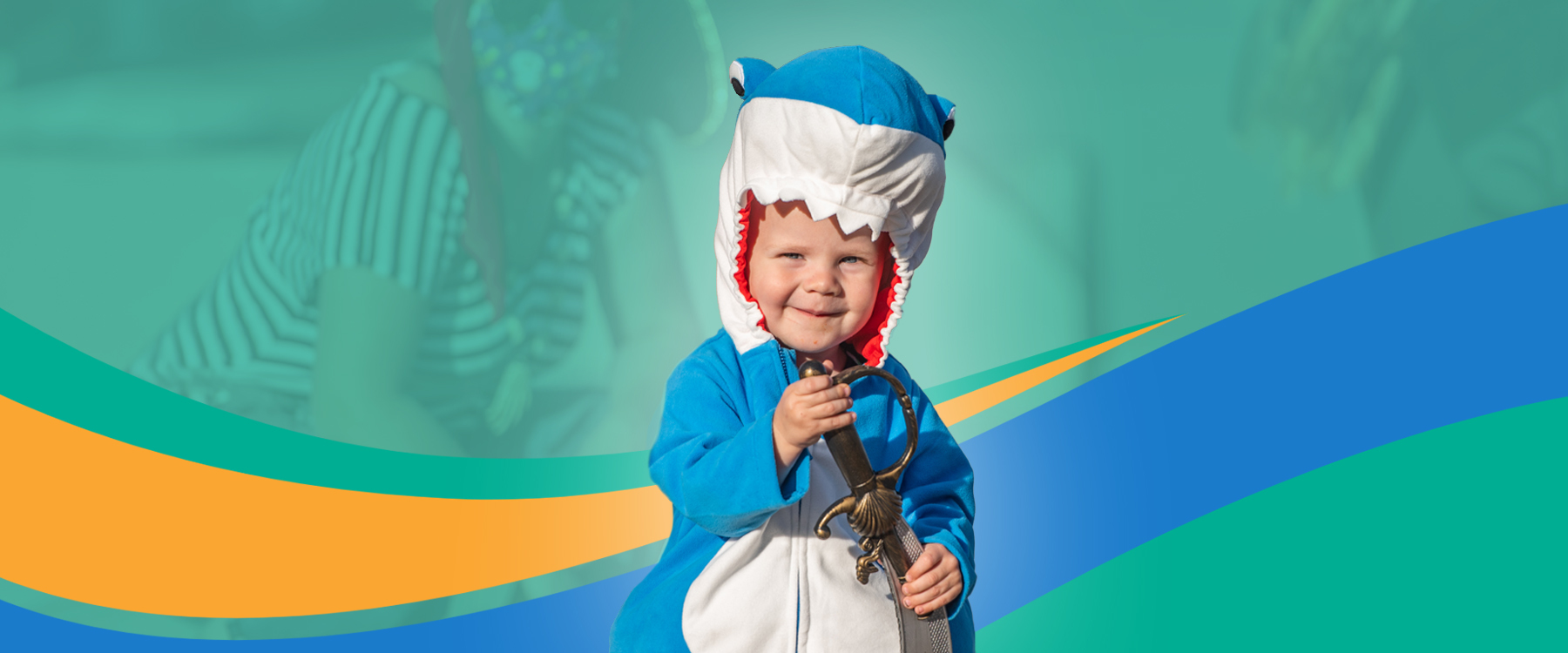 A toddler wearing a cute dinosaur Halloween costume